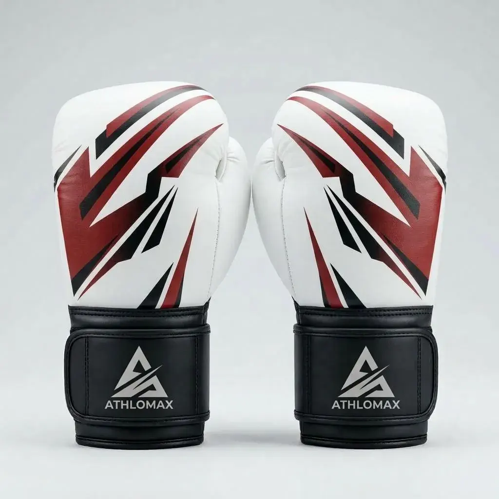 A pair of white Athlomax boxing gloves with an angular red and black print and black hook-and-loop cuffs carrying the Athlomax logo.