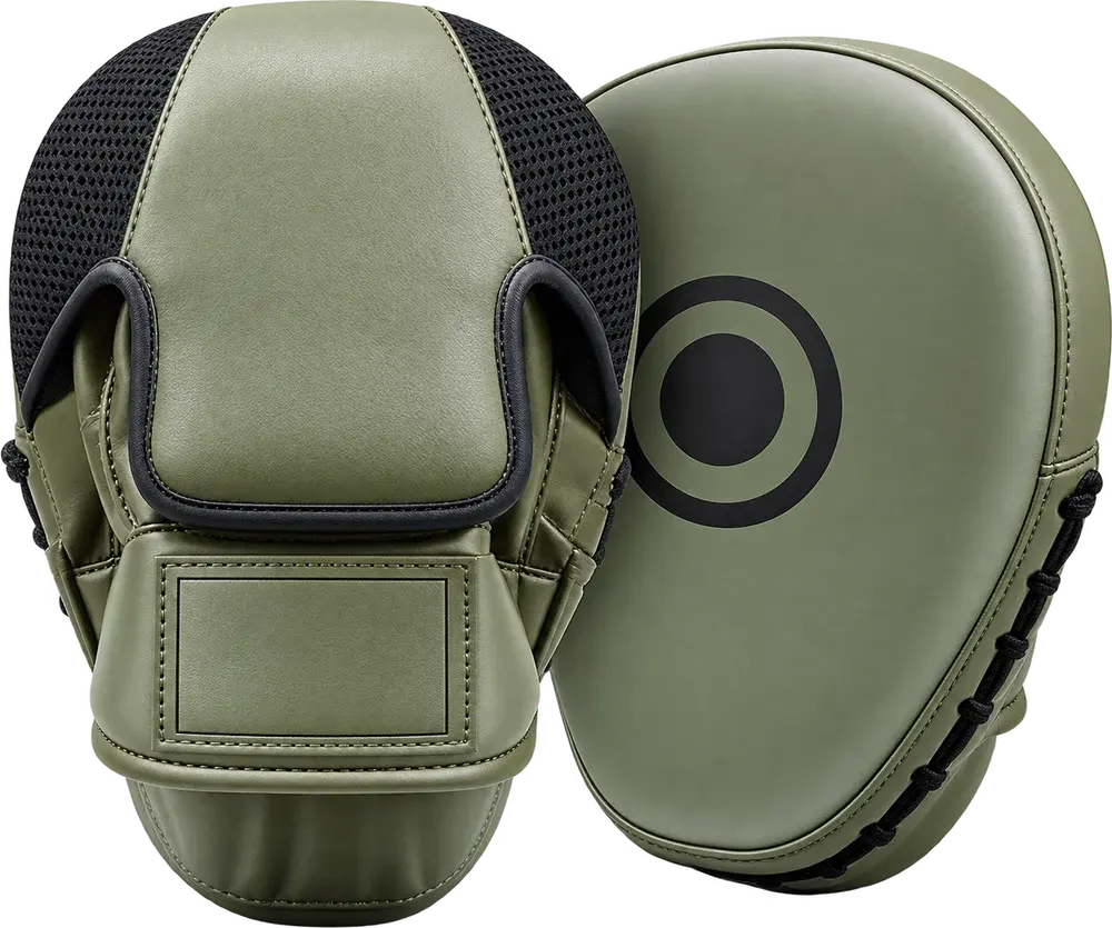 A pair of olive green focus mitts, one showing the curved striking face with a black target ring, the other the black mesh hand compartment with a blank logo panel on the wrist.