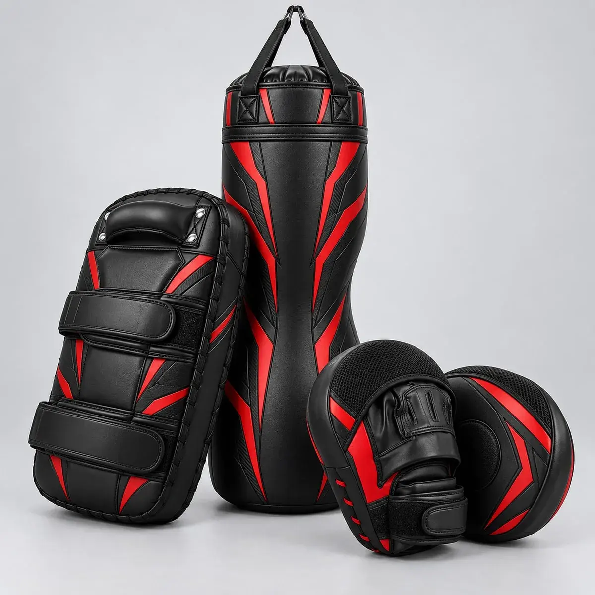 A punch bag, Thai pads and focus mitts in black with red graphics.